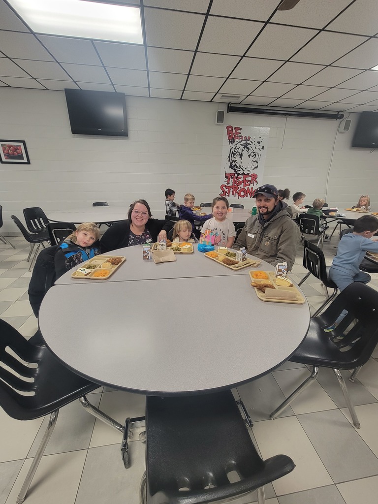 Students with December birthdays eating lunch with family and friends.