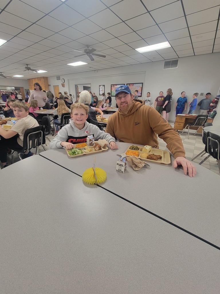 Students with December birthdays eating lunch with family and friends.