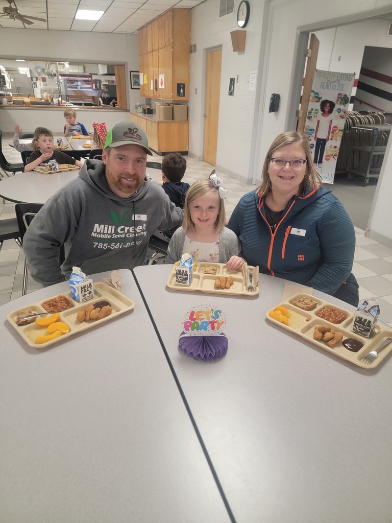 June birthday students with family