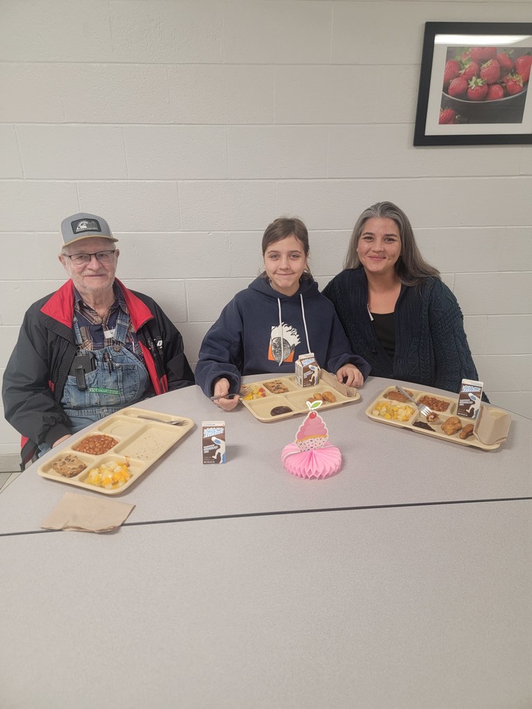 June birthday students with family