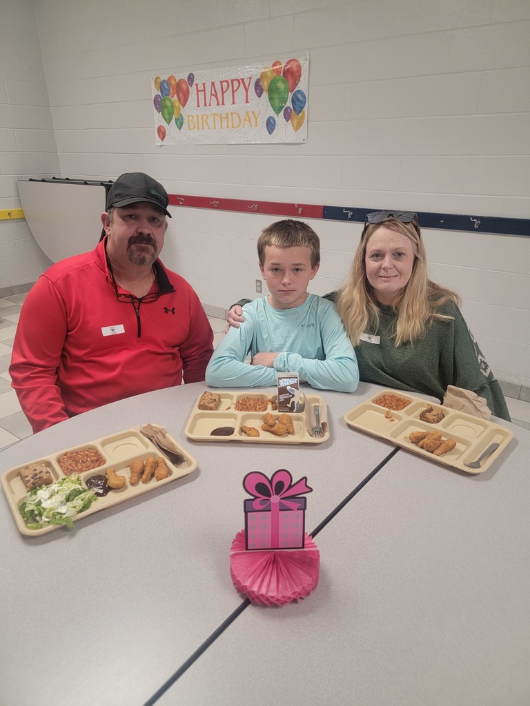 June birthday students with family