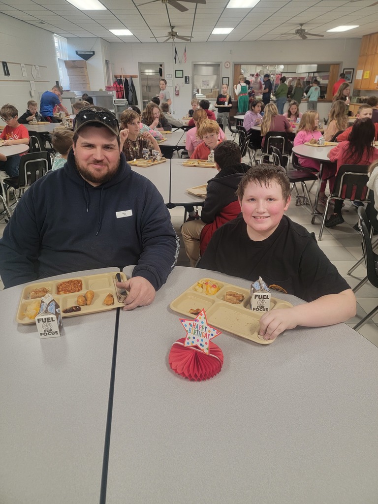 June birthday students with family