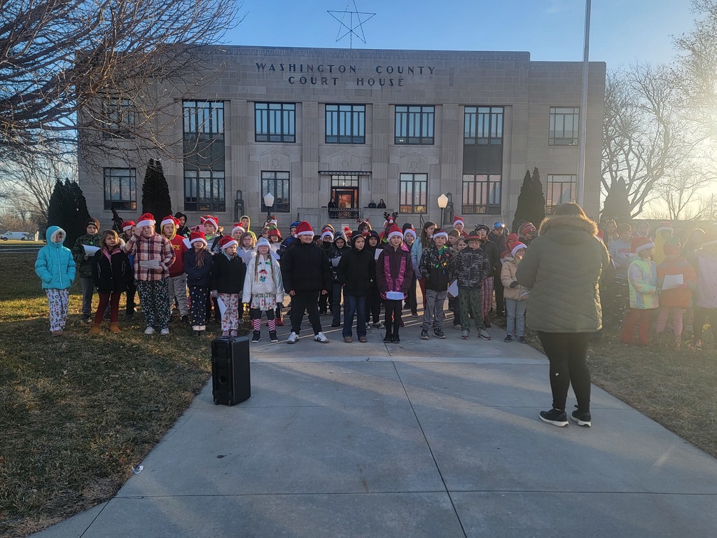 students caroling on courthouse lawn