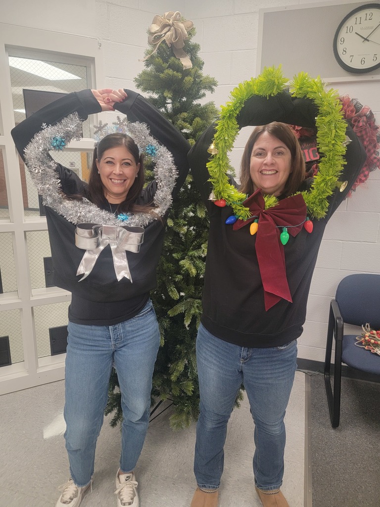 two staff members making a wreath