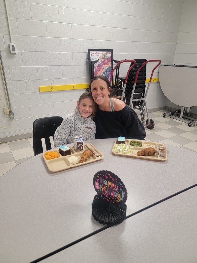 January birthday students eating lunch with family and friends.