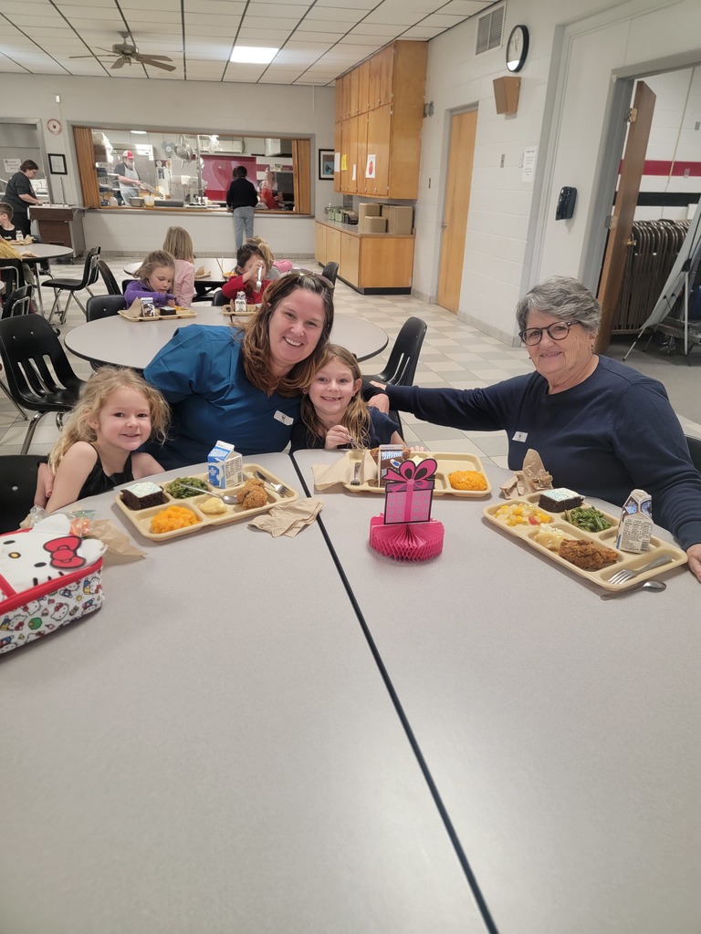 January birthday students eating lunch with family and friends.