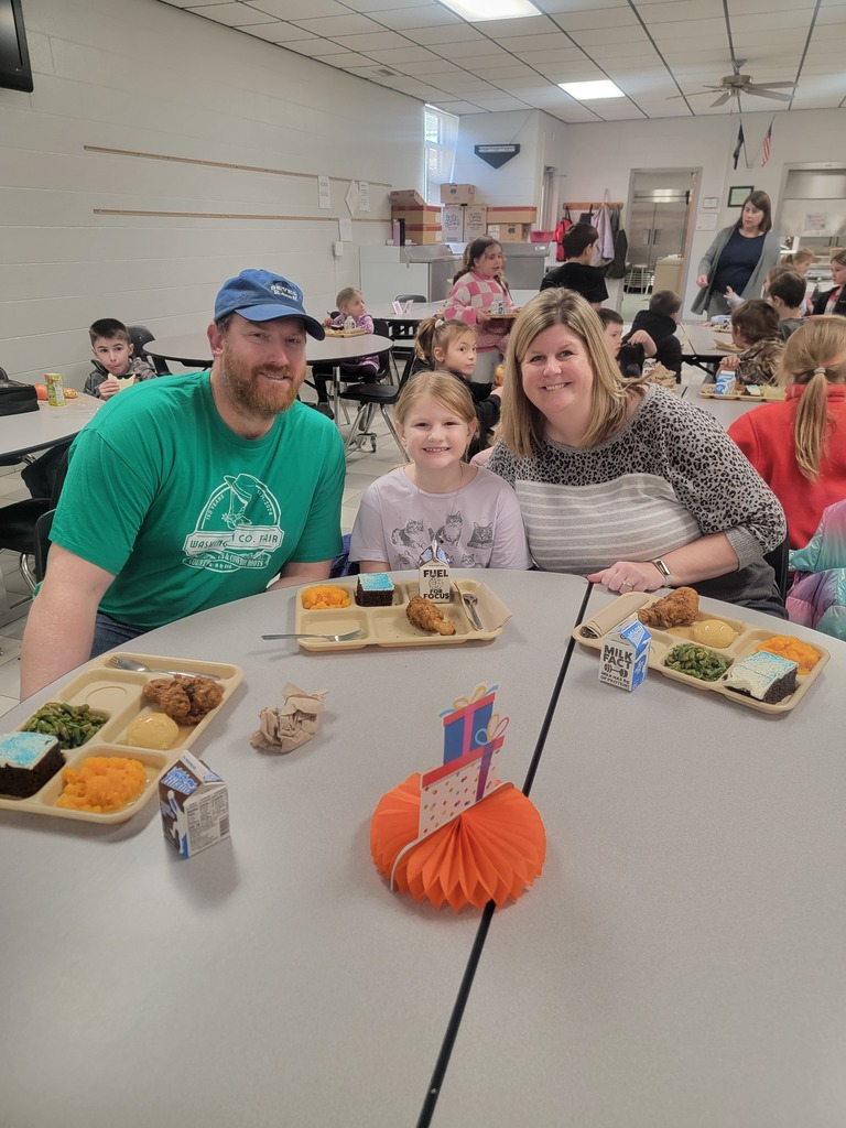 January birthday students eating lunch with family and friends.
