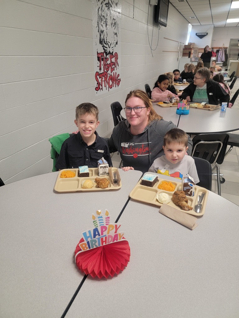 January birthday students eating lunch with family and friends.