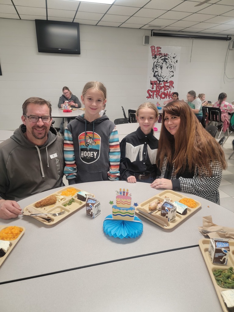 January birthday students eating lunch with family and friends.