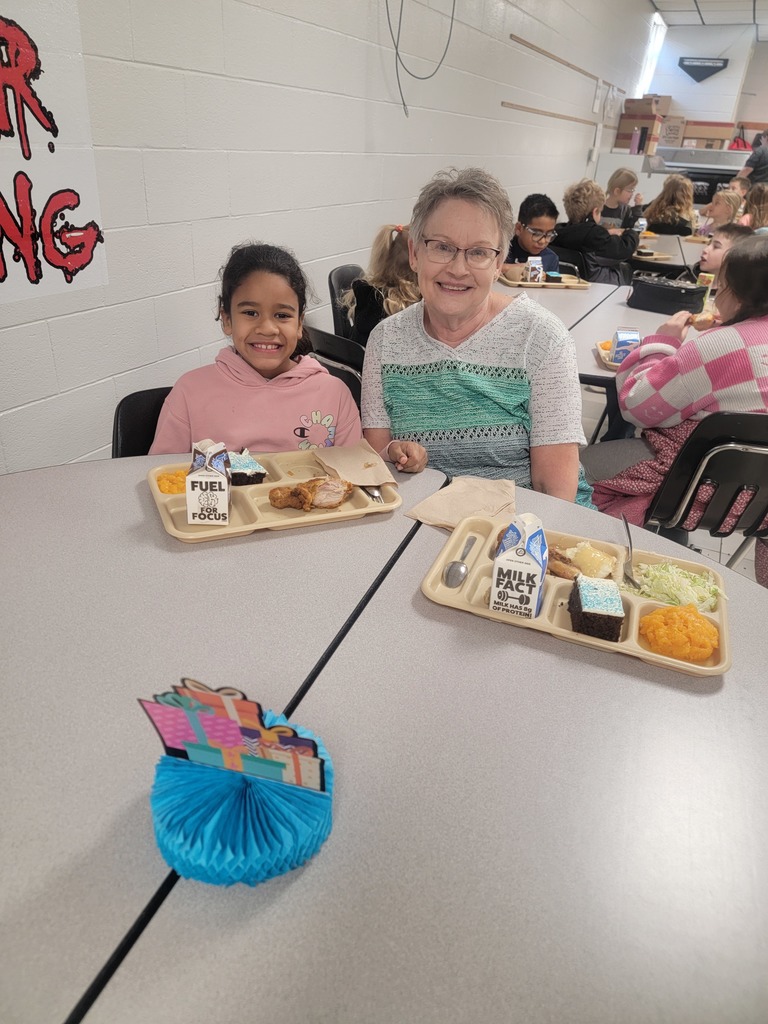 January birthday students eating lunch with family and friends.