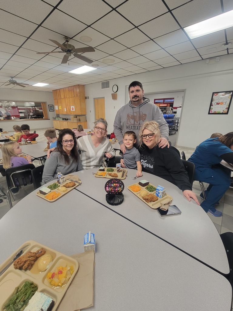January birthday students eating lunch with family and friends.