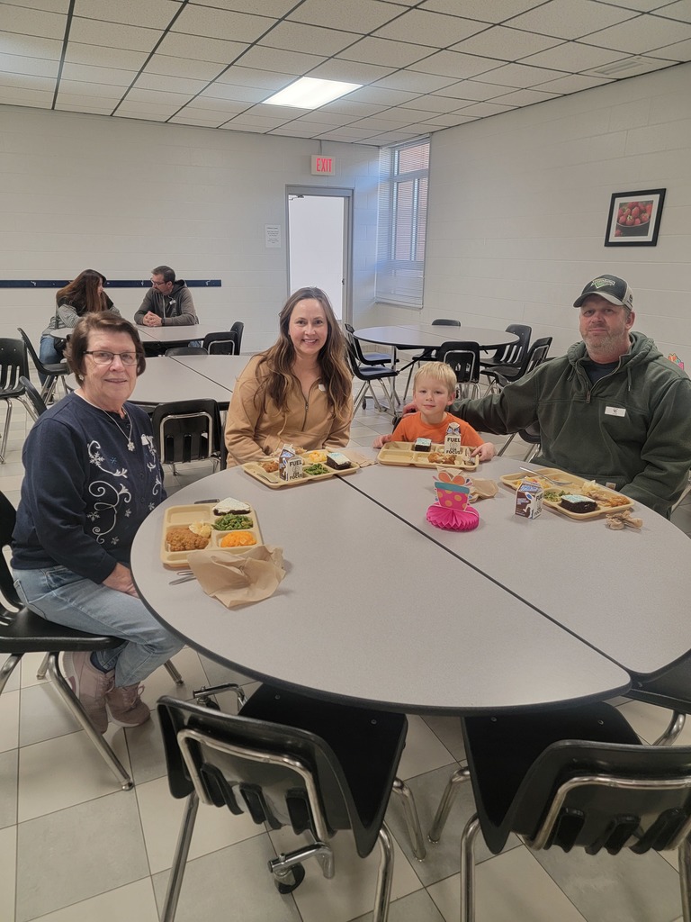 January birthday students eating lunch with family and friends.