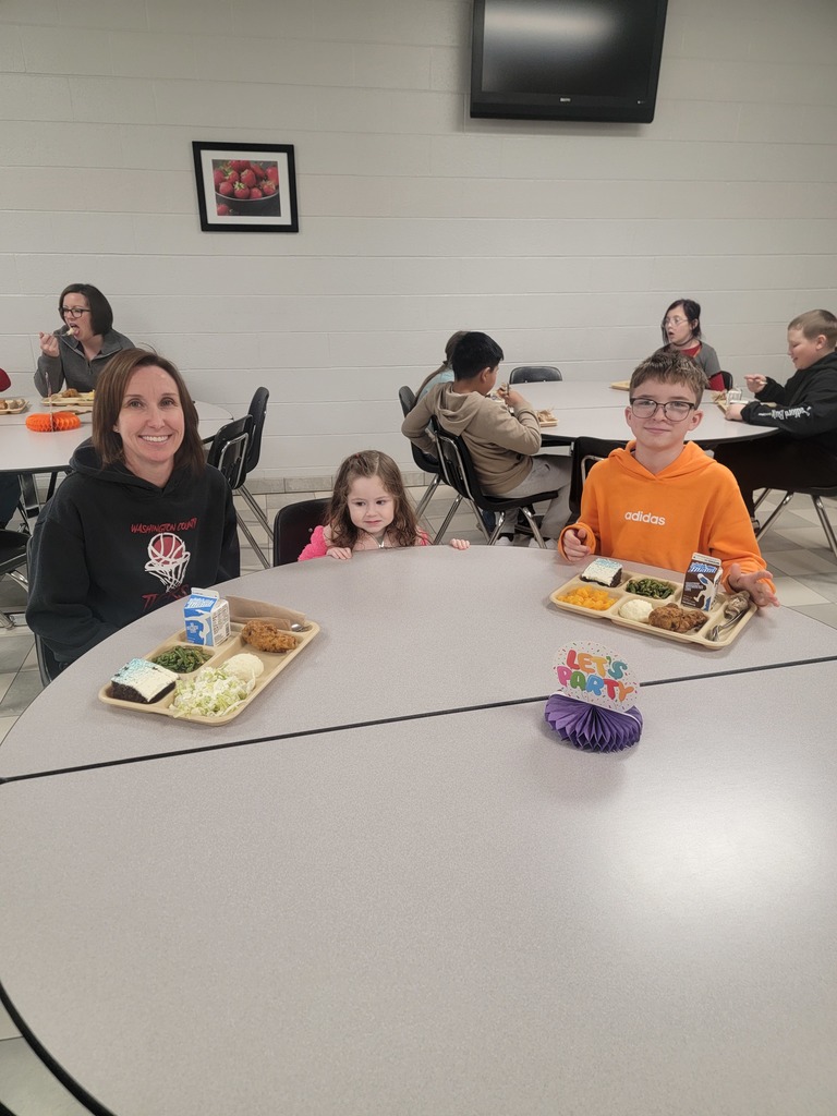 January birthday students eating lunch with family and friends.