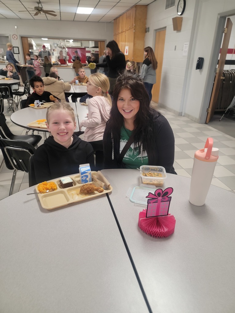 January birthday students eating lunch with family and friends.
