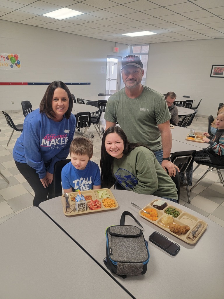 January birthday students eating lunch with family and friends.