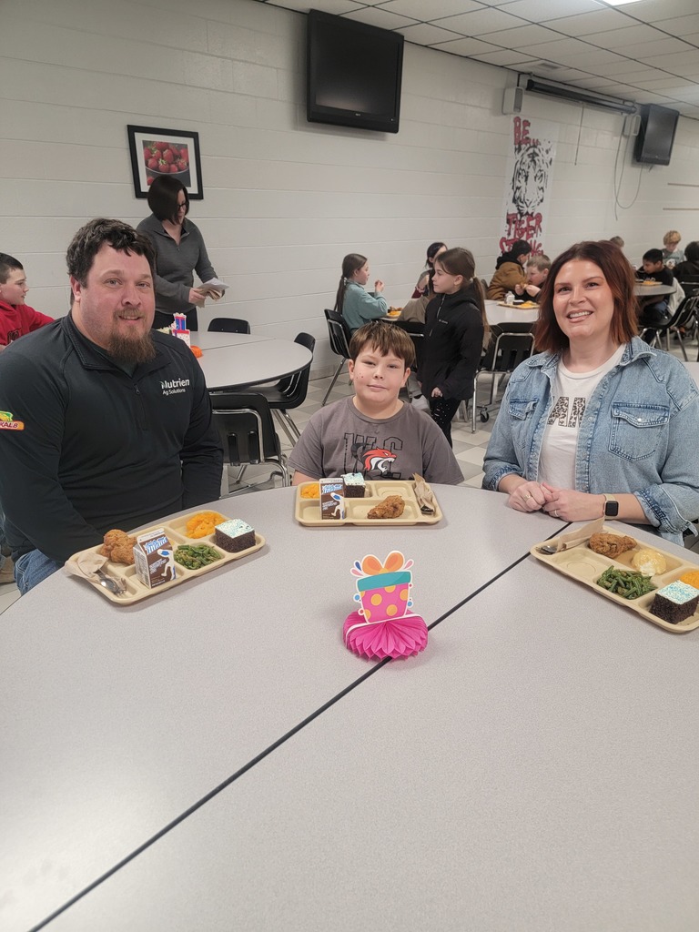 January birthday students eating lunch with family and friends.