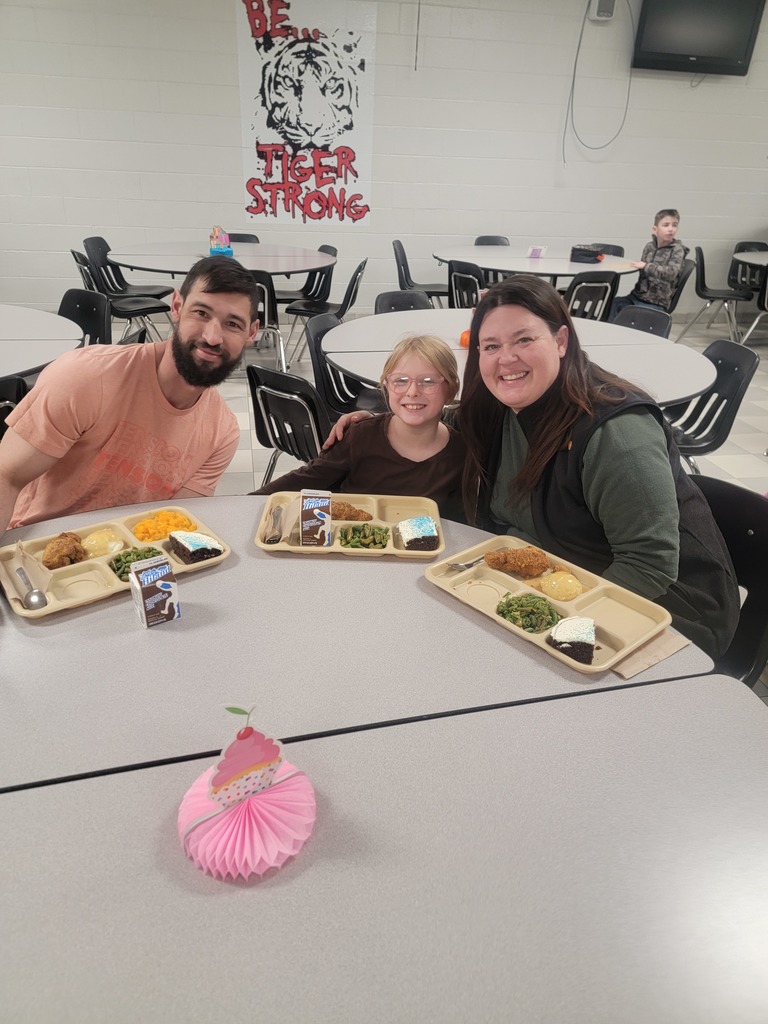 January birthday students eating lunch with family and friends.