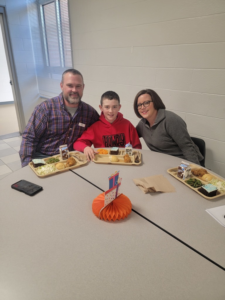 January birthday students eating lunch with family and friends.