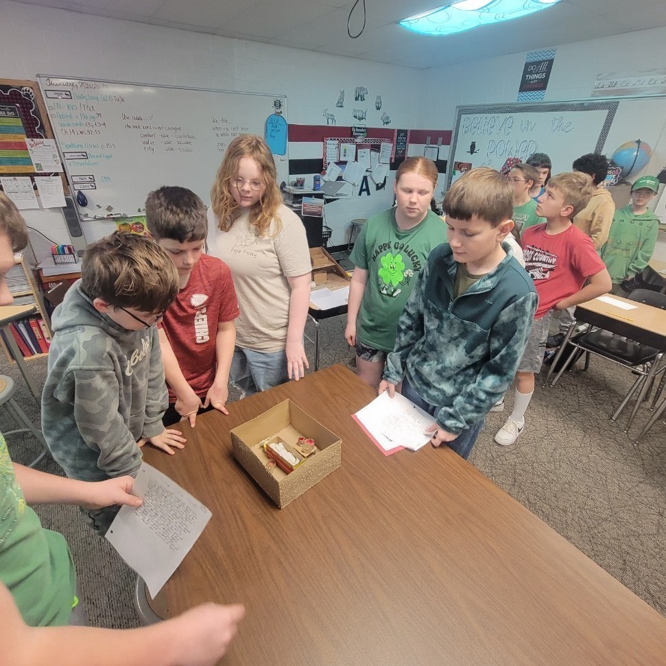 students explaining a tomb