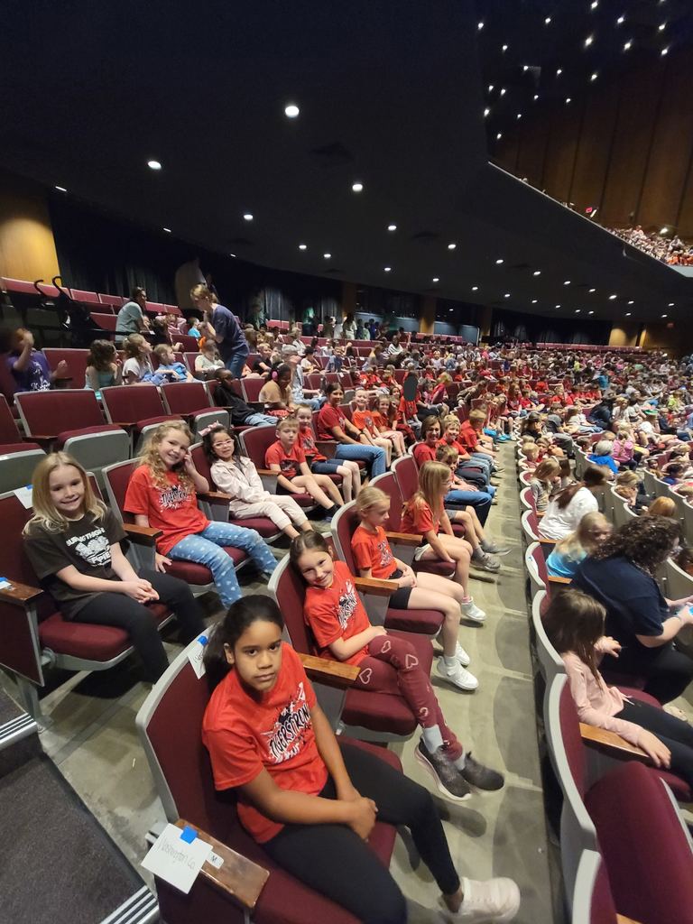 students sitting in chairs waiting for Bubble Trouble