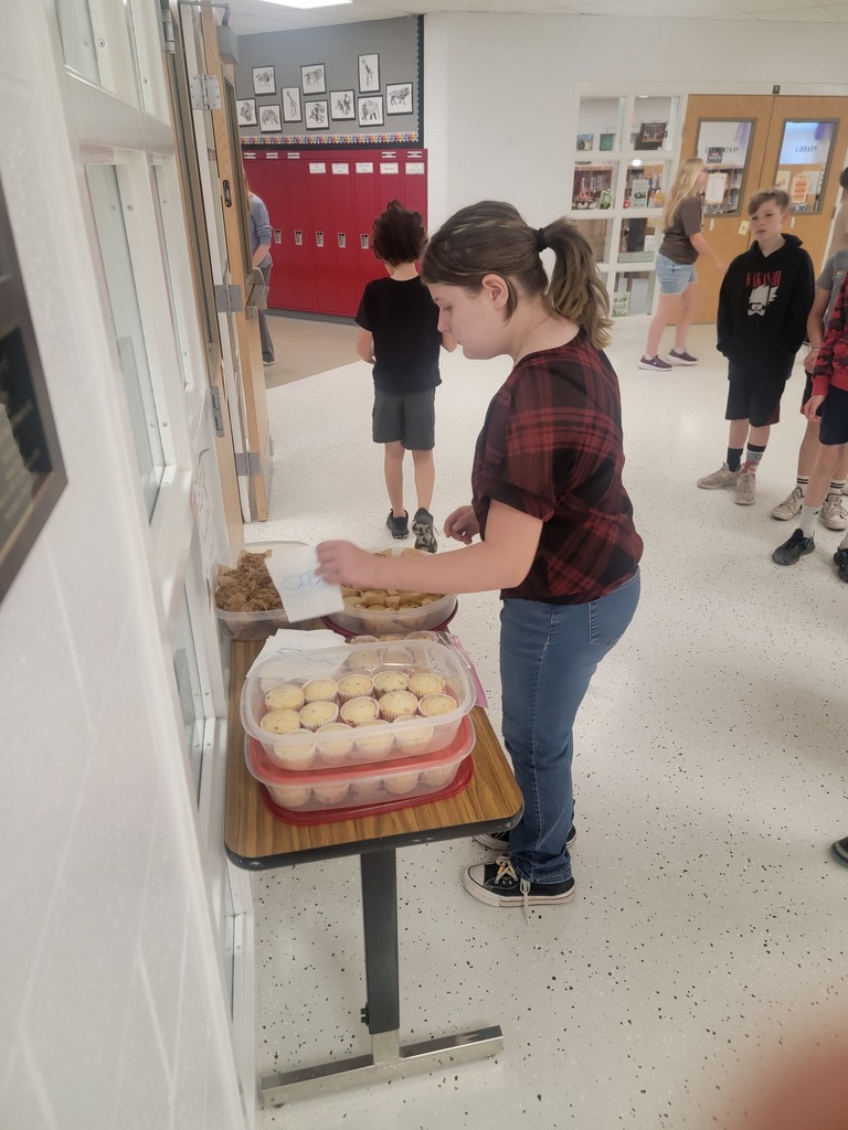 student getting muffin