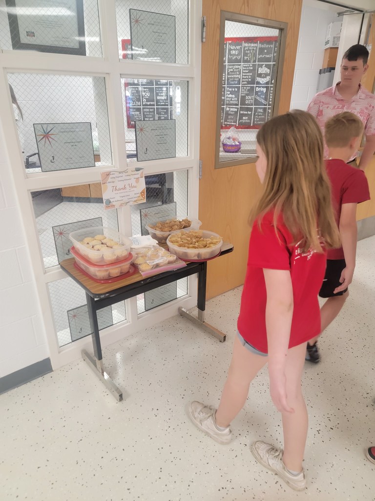 student getting muffin