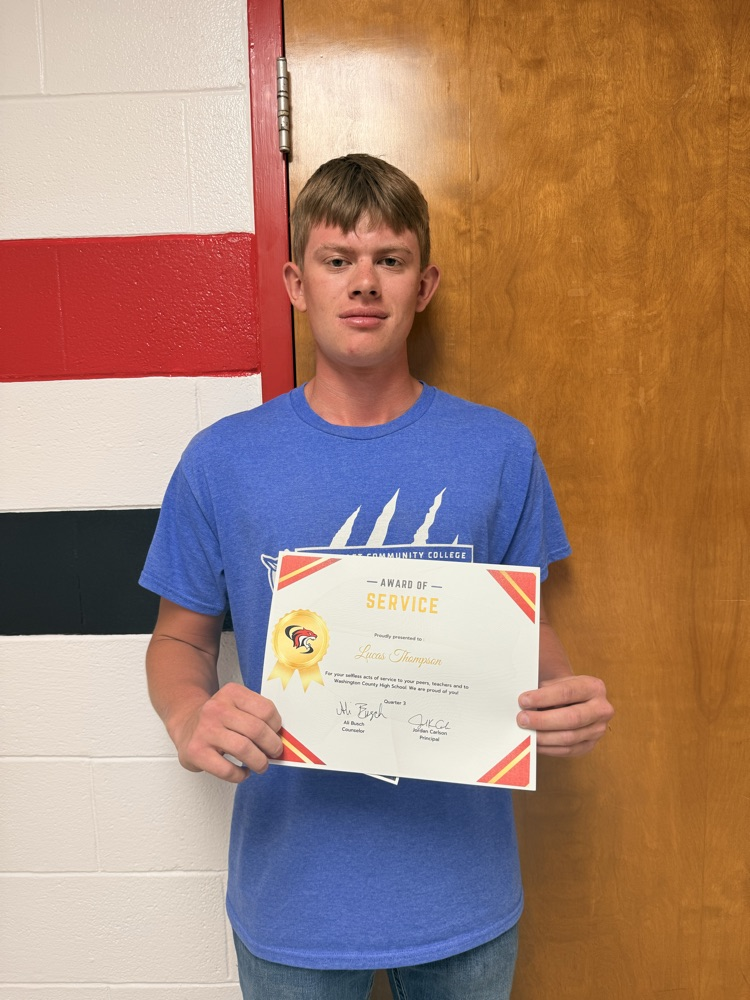 Lucas Thompson receives the award for Service