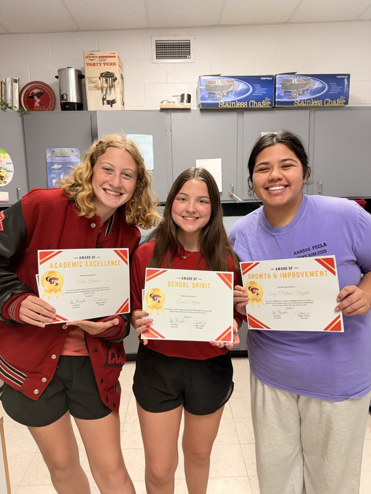 Nora Brabec receives the award for Academic Excellence, Correl Miller receives the award for School Spirit and Susy Pallais-Trujillo receives the award for growth and Improvement