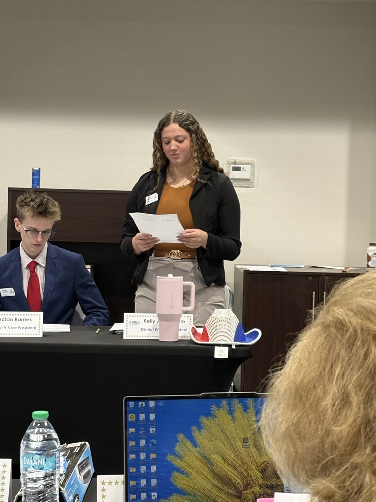 Kelly giving her officer report