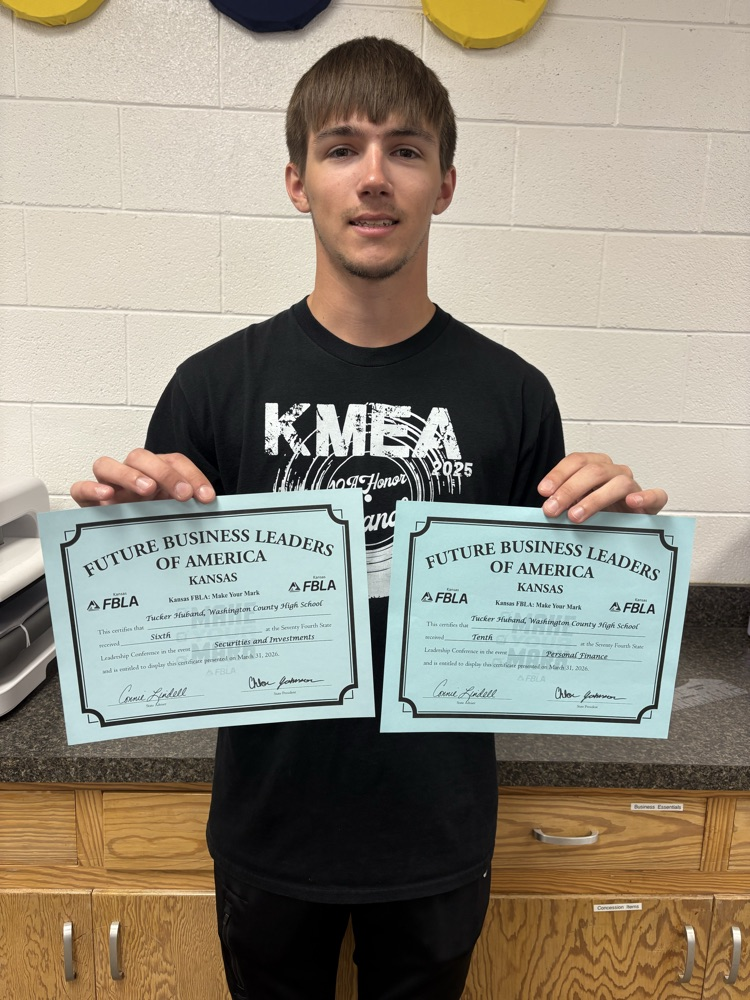 Tucker Huband with certificates