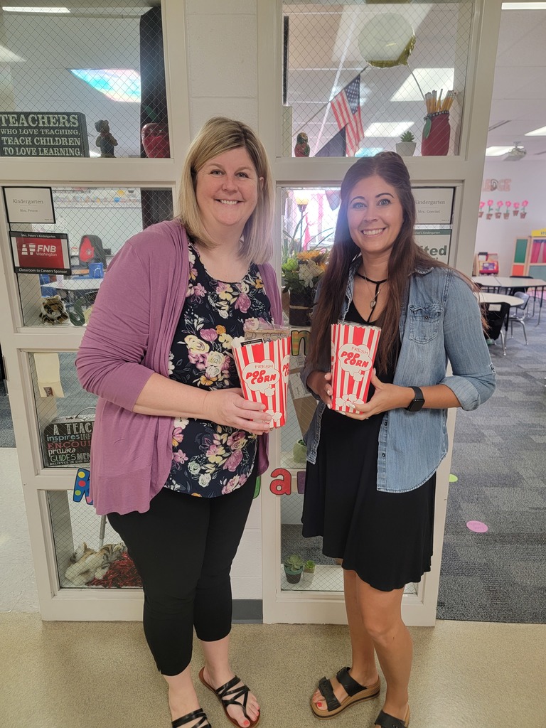 two teachers holding treat