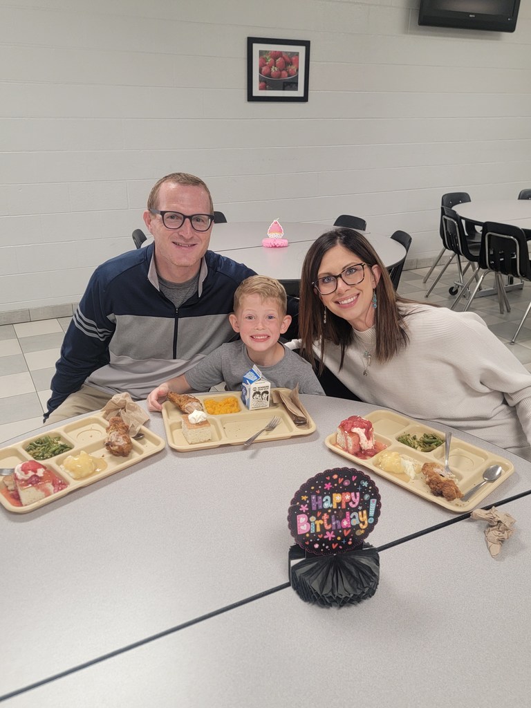 students with May birthdays eating with family and friends