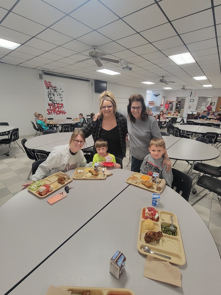 students with May birthdays eating with family and friends