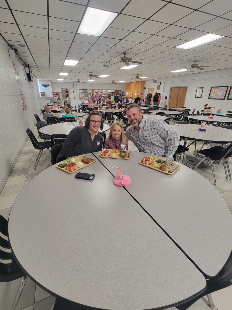 students with May birthdays eating with family and friends
