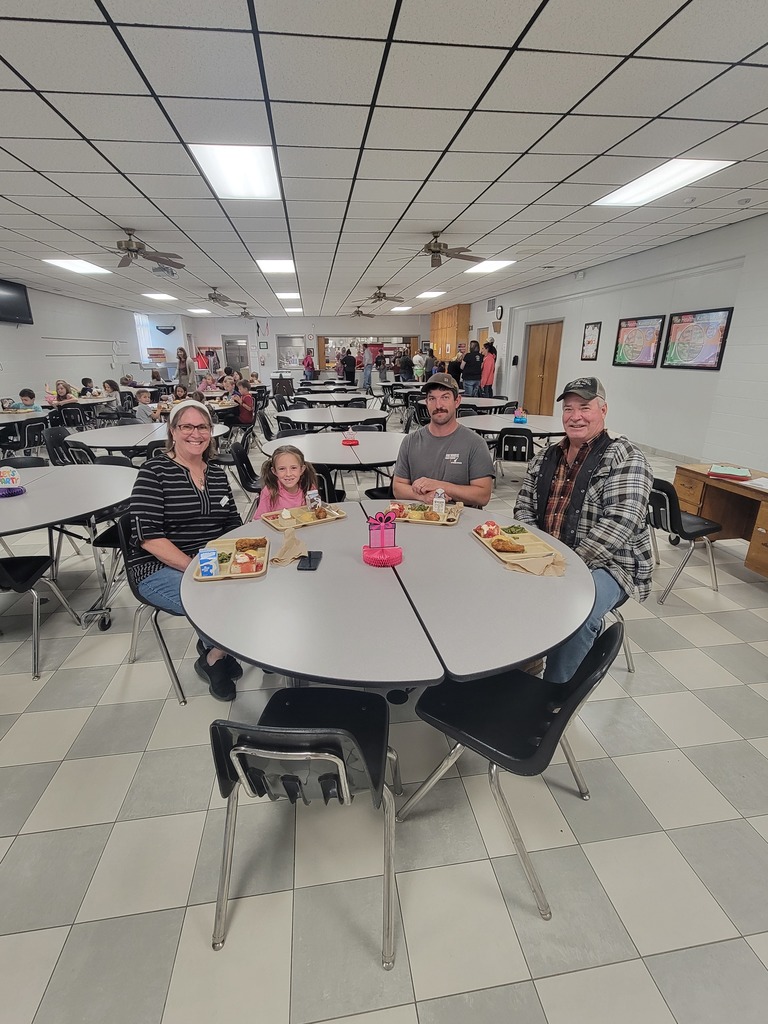 students with May birthdays eating with family and friends
