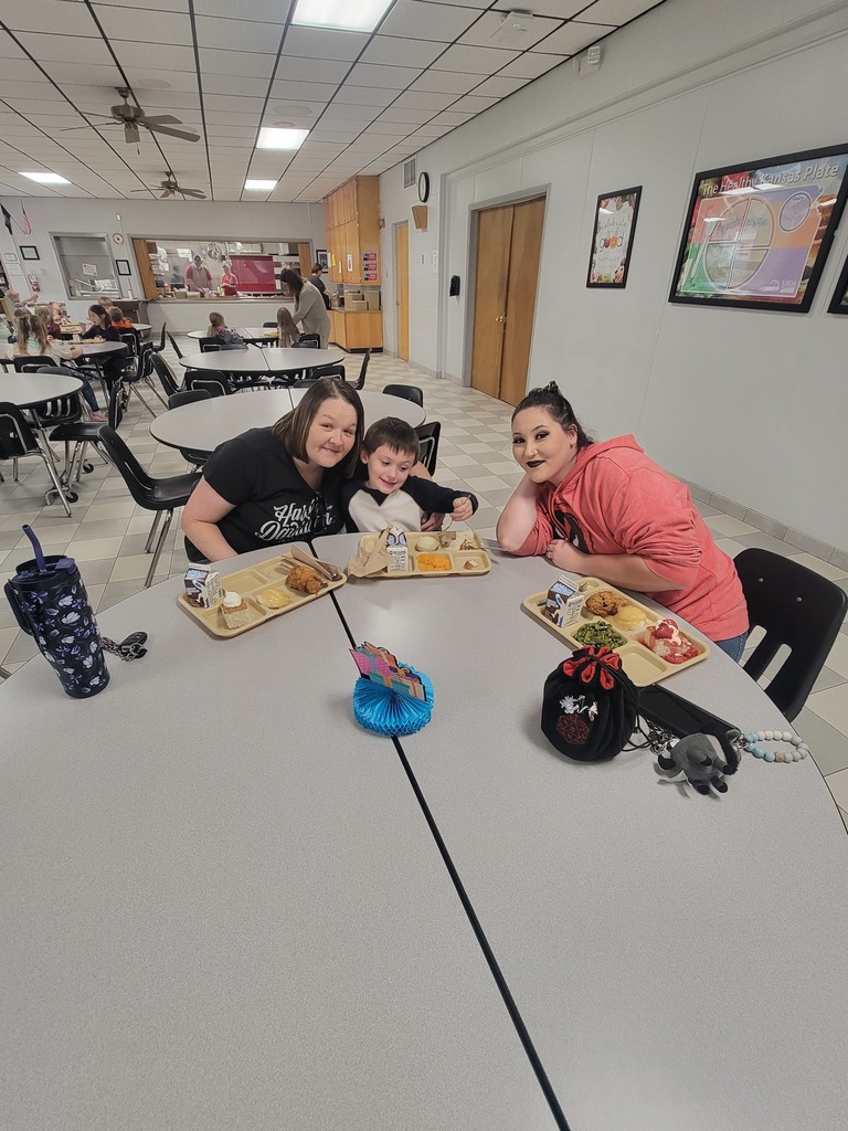 students with May birthdays eating with family and friends