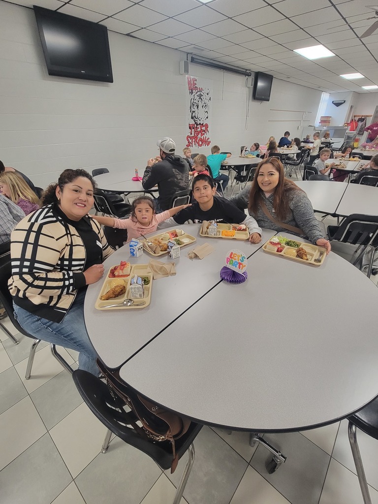 students with May birthdays eating with family and friends