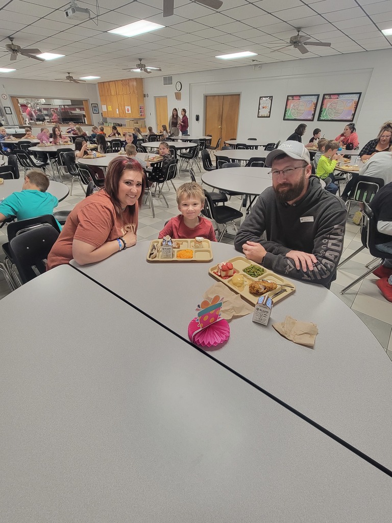students with May birthdays eating with family and friends