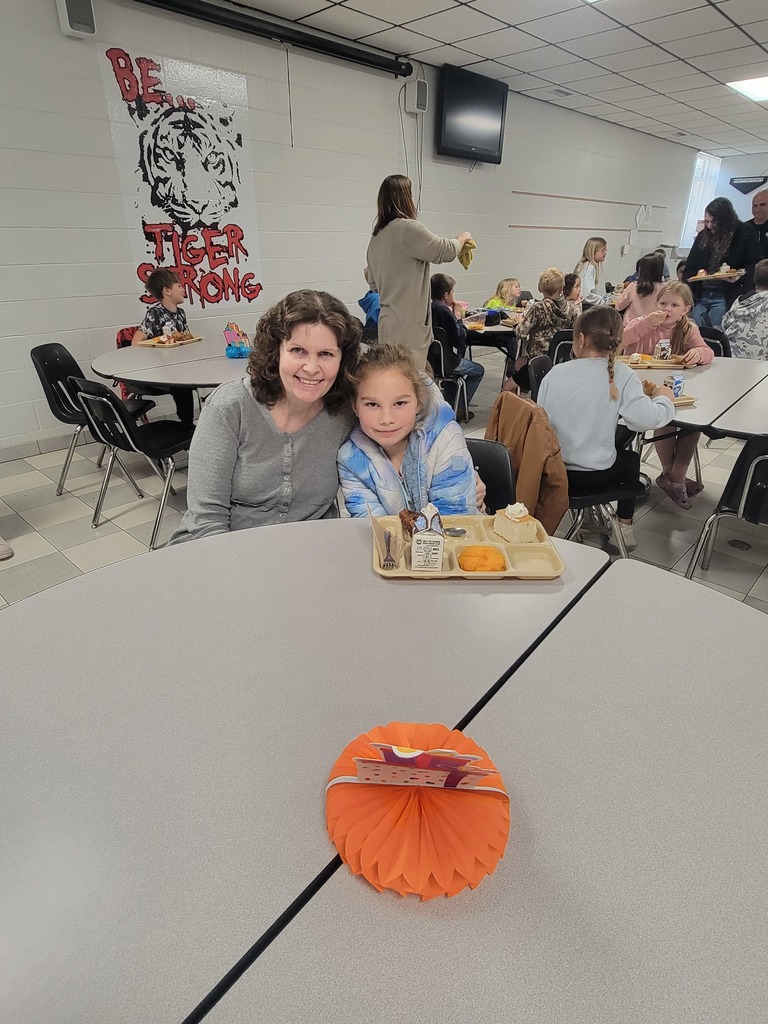 May birthday students eating lunch with family.
