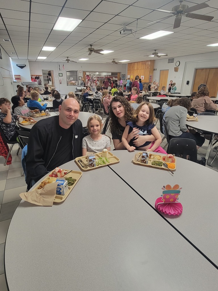 May birthday students eating lunch with family.