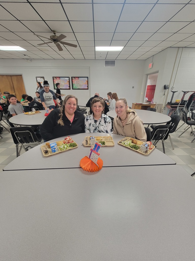 May birthday students eating lunch with family.