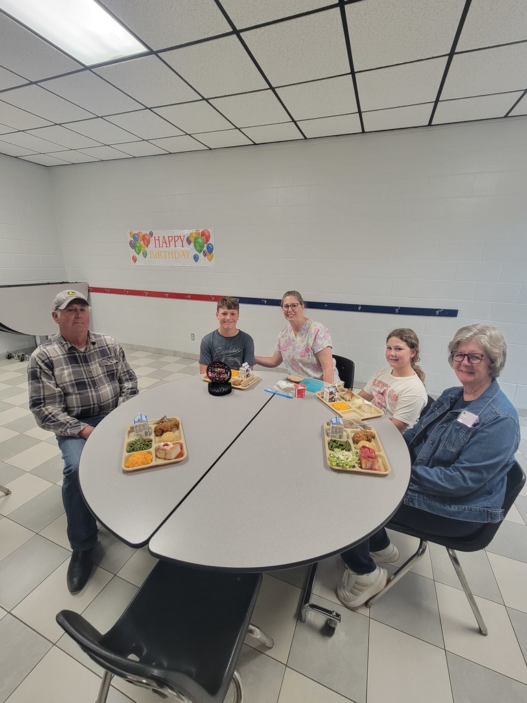 May birthday students eating lunch with family.