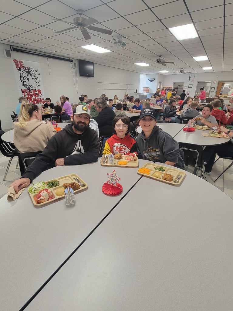May birthday students eating lunch with family.
