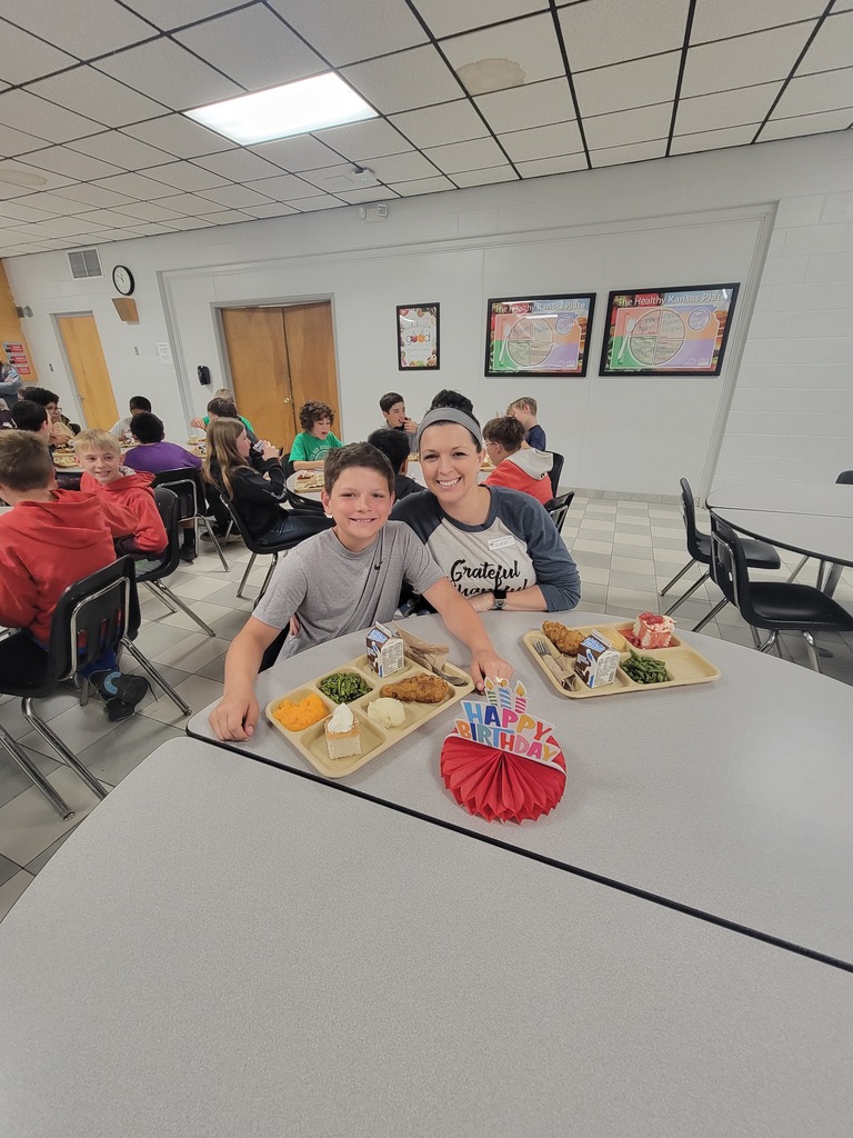 May birthday students eating lunch with family.