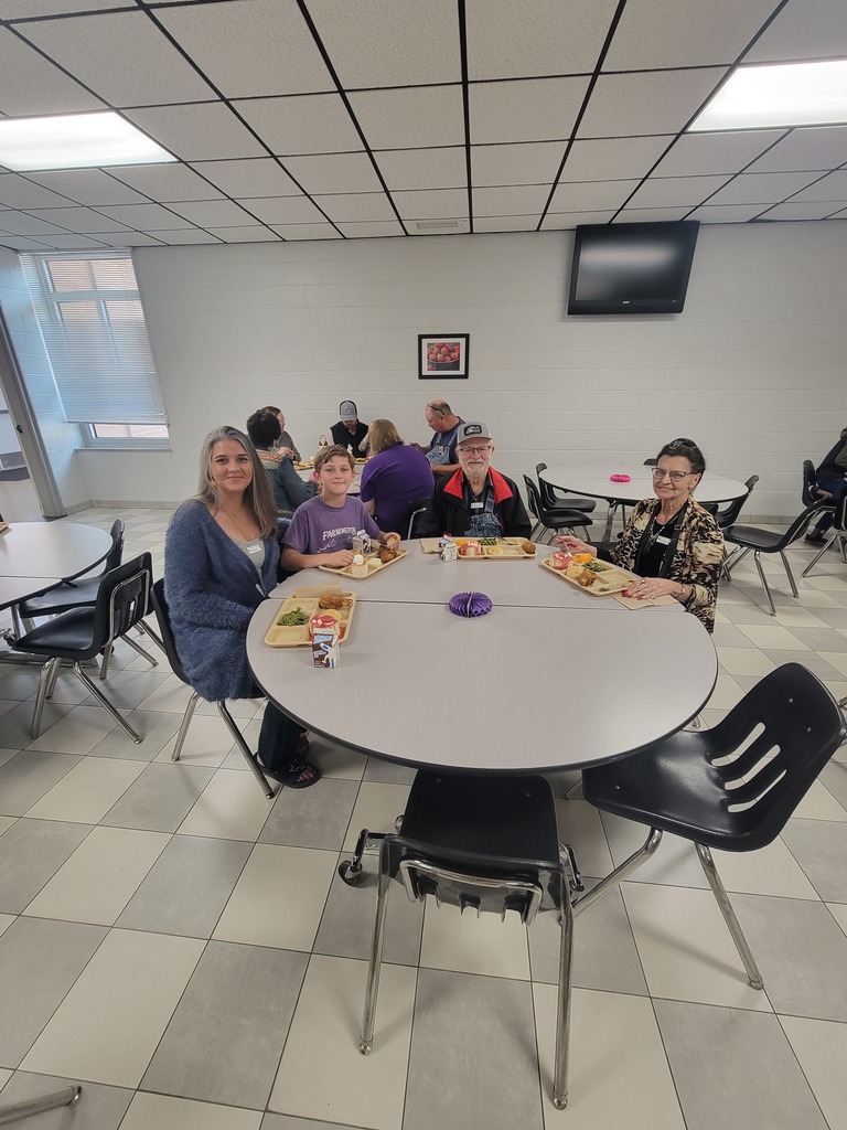 May birthday students eating lunch with family.
