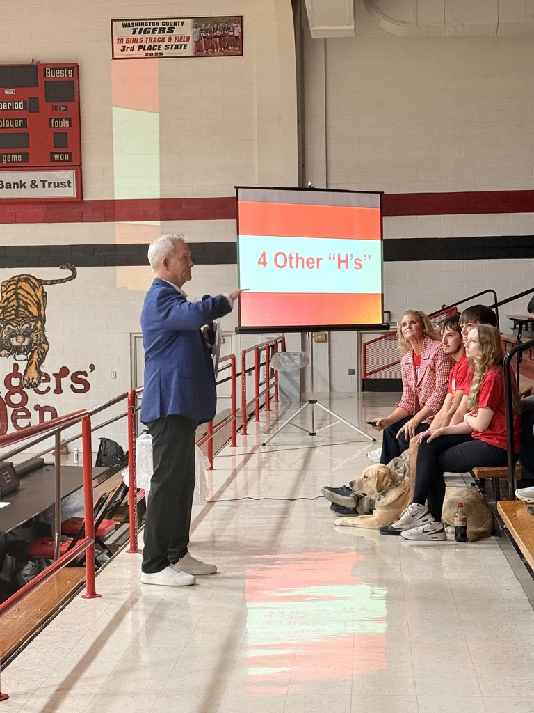 Voice of the Chiefs, Mitch Holthus, speaking to students in grades 9 through 12 from Washington County, Hanover, and Linn