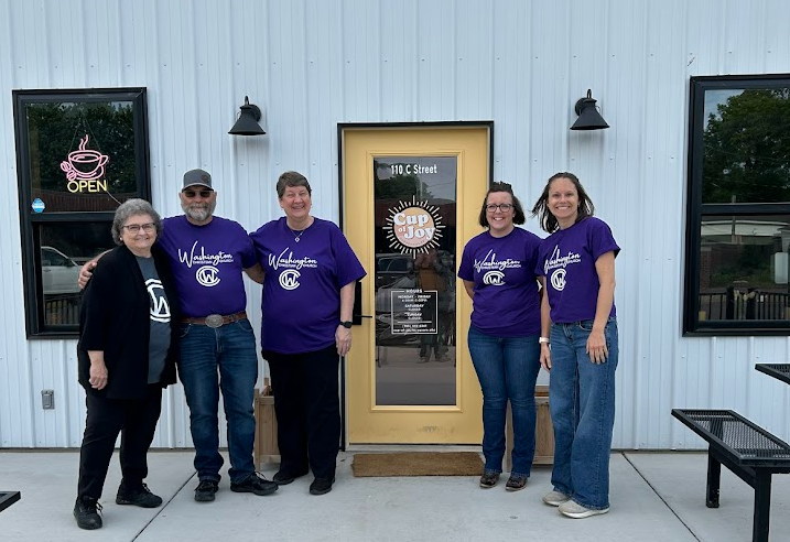 5 members of Christian Church in front of Cup of Joy