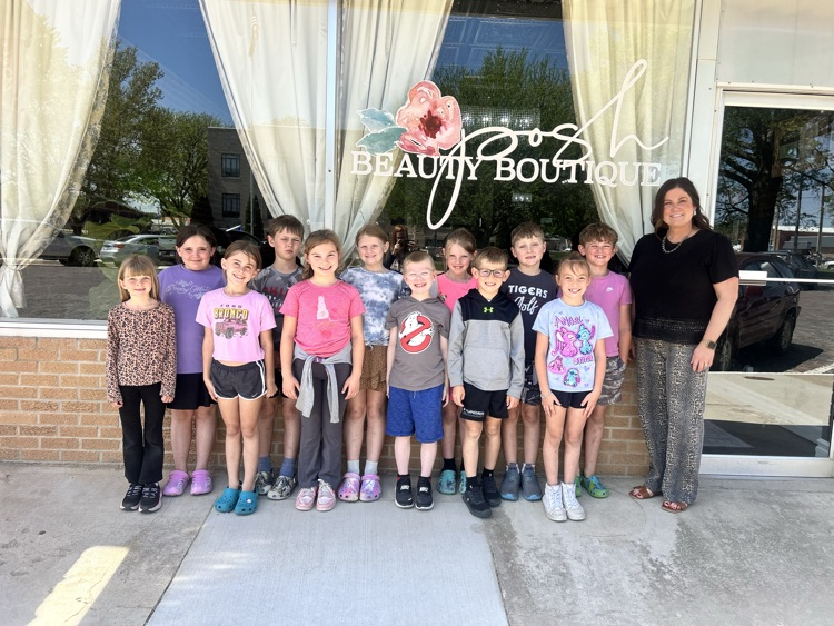 students with Megan in front of salon