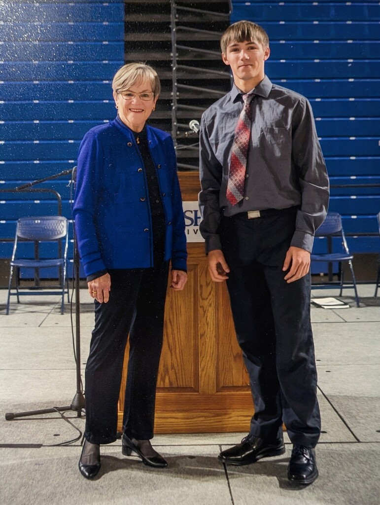 WCHS Senior, Tucker Huband, posing with Kansas Governor, Laura Kelly, at the Governor's Scholar Ceremony