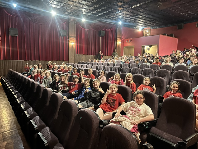 2nd grade class waiting for movie to start